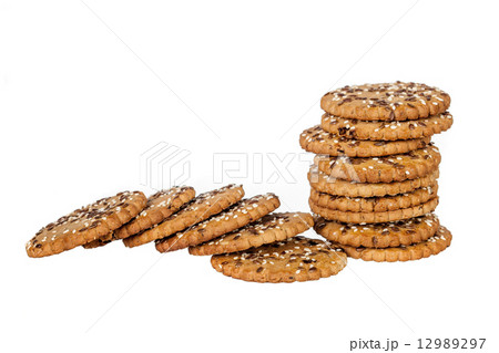 Stackand pile of round cookies with sesame and flax seeds Stackand pile of round cookies with sesame and flax seeds 12989297