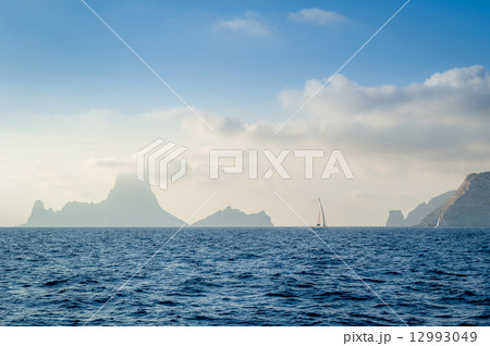 Yacht and rocks in the fog 12993049