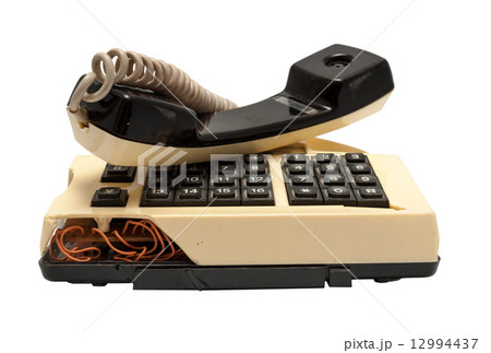 Telephone collection - crashed phone on white background 12994437