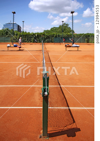 Playing tennis 12994553