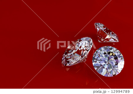 Three diamonds on red glossy background 12994789