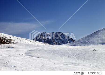 Ski slope at sunny day 12994865