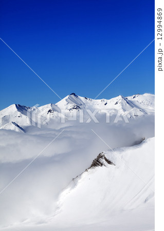 Winter snowy mountains at nice day 12994869