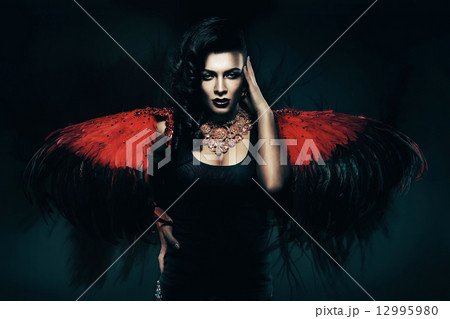 transvestite with red wings behind transvestite with red wings behind 12995980
