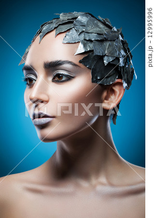 pretty woman in hat of silver leaves pretty woman in hat of silver leaves 12995996