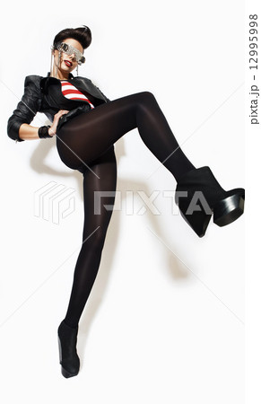 rock n roll woman in glasses and jacket 12995998