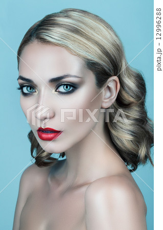 blond woman with red lips and curly hair blond woman with red lips and curly hair 12996288