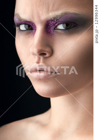 woman with violet make-up 12996344