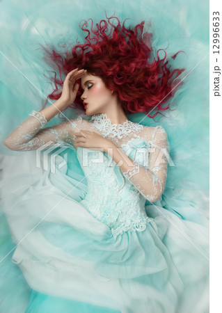 fashion girl lying in a turquoise dress 12996633