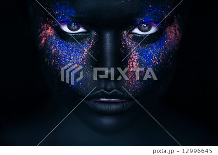 girl in black paint and neon powder 12996645