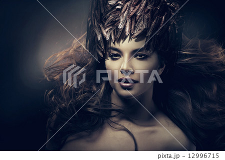 attractive woman with long hair and feather hat attractive woman with long hair and feather hat 12996715
