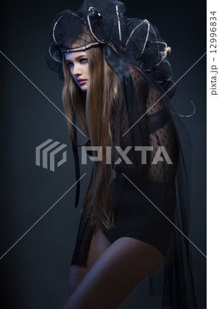 glamour young long hair woman in black 12996834