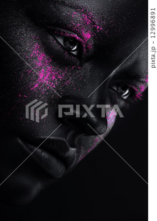 woman in black paint and neon pink powder 12996891