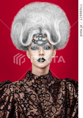 Close-up portrait of a woman with creative hairstyle 12996911