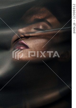 beautiful woman under transparent textile 12996912