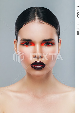 woman with smooth hair and red lips 12997131