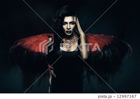 woman with red wings behind woman with red wings behind 12997167