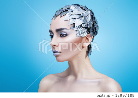 frozen woman in hat of leaves 12997189
