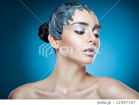 cold woman in accessory of silver leaves cold woman in accessory of silver leaves 12997197