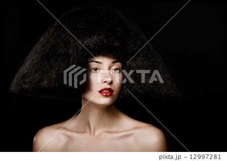 Portrait of a woman with bouffant and red lips 12997281