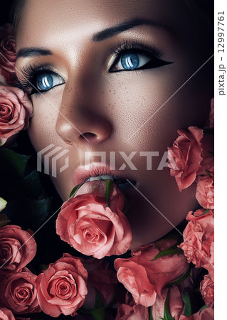 woman with pink rose in mouth woman with pink rose in mouth 12997761