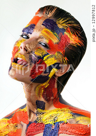 sexy woman with bodyart on face 12997812