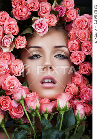 Hot woman in the flowers of roses Hot woman in the flowers of roses 12997881