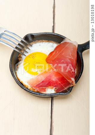 egg sunny side up with italian speck ham egg sunny side up with italian speck ham 13010198
