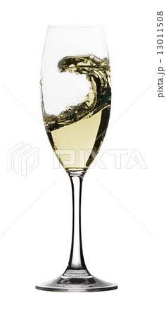 White wine in a glass glass on a white background White wine in a glass glass on a white background 13011508
