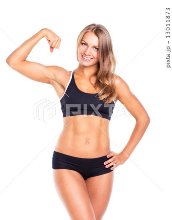 Young sports girl does exercises on a white 13011873
