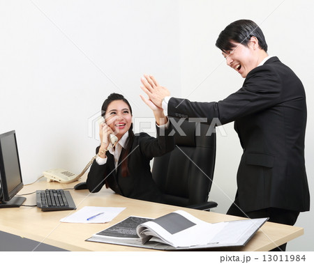 Man woman office hi five joy victory congratulate  13011984