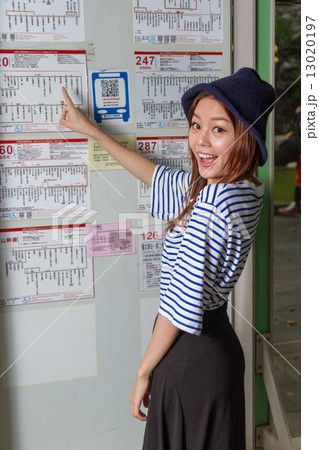 Asian woman at bus stop Asian woman at bus stop 13020197