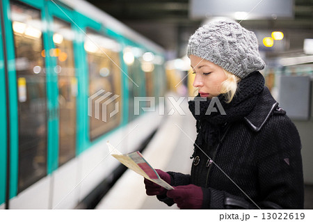 Lady waiting on subway station platform. 13022619