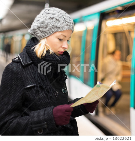 Lady waiting on subway station platform. 13022621