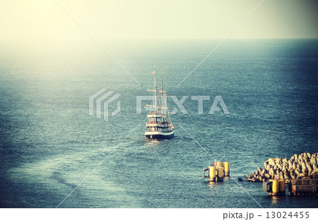 Vintage picture of old sailing ship leaving port. 13024455