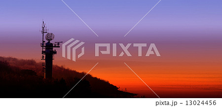 Silhouette of a radar station on the Polish coast at sunset. 13024456