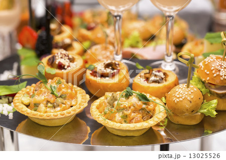 Canapes of cheese vegetables meat and seafood on white background Canapes of cheese vegetables meat and seafood on white background 13025526