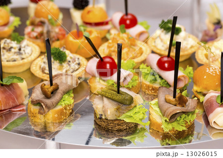 Canapes of cheese vegetables meat and seafood on white background Canapes of cheese vegetables meat and seafood on white background 13026015