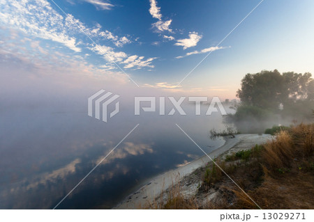 Beautiful morning with rising sun on lake 13029271