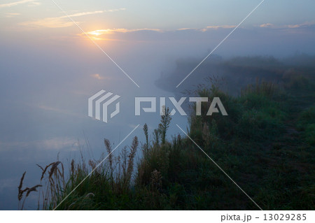 Beautiful morning with rising sun on lake Beautiful morning with rising sun on lake 13029285