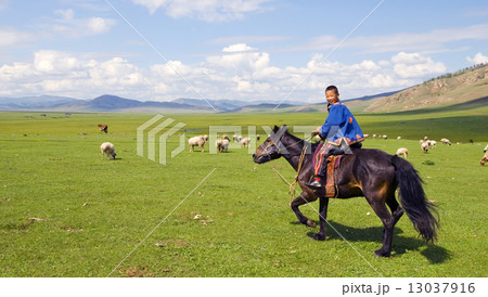 Boy Riding A Horse In A Beautiful Scenic View Of Nature 13037916