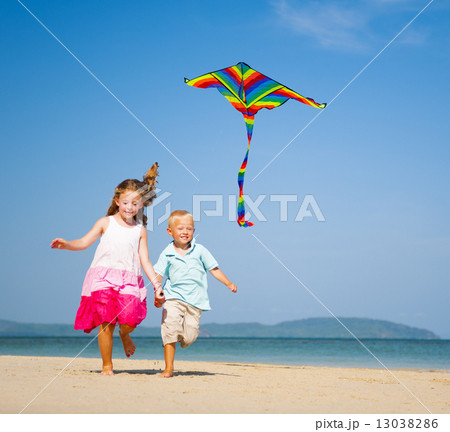 Children running on the beach 13038286