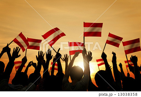 Silhouettes of People Holding Flag of Austria 13038358