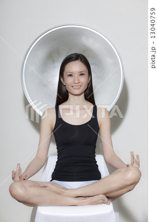 Asian female doing yoga Asian female doing yoga 13040759