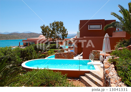 Swimming pool with jacuzzi by luxury villa, Crete, Greece Swimming pool with jacuzzi by luxury villa, Crete, Greece 13041331