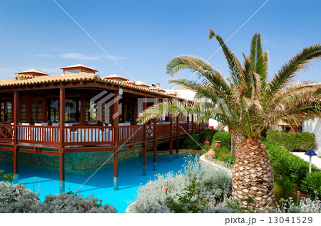 Open-air restaurant and swimming pool at luxury hotel, Crete, Gr Open-air restaurant and swimming pool at luxury hotel, Crete, Gr 13041529