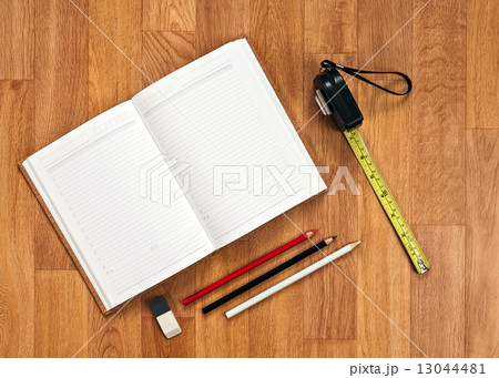 Blank notepad with office supplies on wooden table. Blank notepad with office supplies on wooden table. 13044481