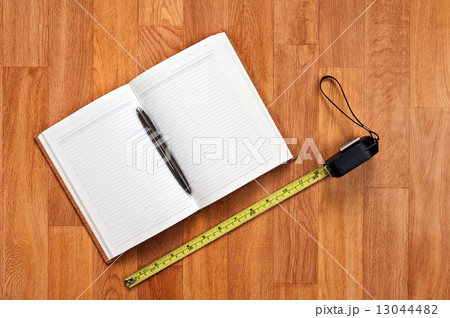 Blank notepad with office supplies on wooden table. Blank notepad with office supplies on wooden table. 13044482