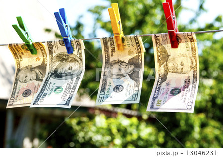 paper dollars are drying on rope paper dollars are drying on rope 13046231