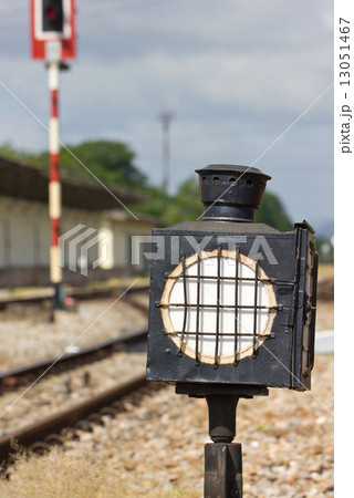 Old steel train sign lantern beside the railway's track. 13051467